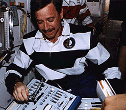 Astronaut wearing casual clothes in the shuttle