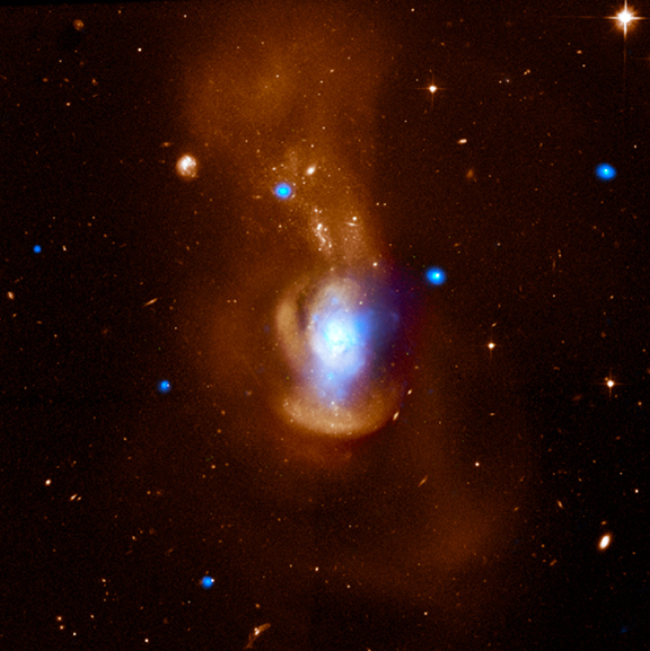 composite image of the Medusa galaxy (also known as NGC 4194) shows X-ray data from NASA's Chandra X-ray Observatory in blue and optical light from the Hubble Space Telescope in orange