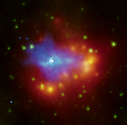 Chandra X-ray and Spitzer IR image of a pulsar wind nebula in blue and the dusty shell surrounding it
