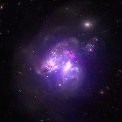 X-ray image from Chandra, NuSTAR superimposed on an optical image of the star forming galaxy Arp 299