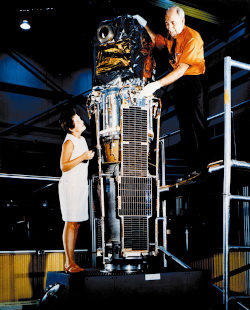 Marjorie Townsend and Bruno Rossi examine SAS-A at NASA's Goddard Space Flight Center