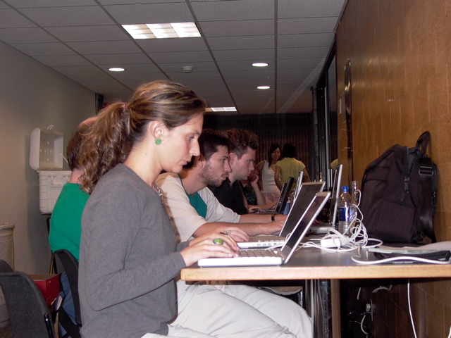 Alicia and other students at work